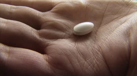 Pills in a palm, close-up Stock Footage 11332702