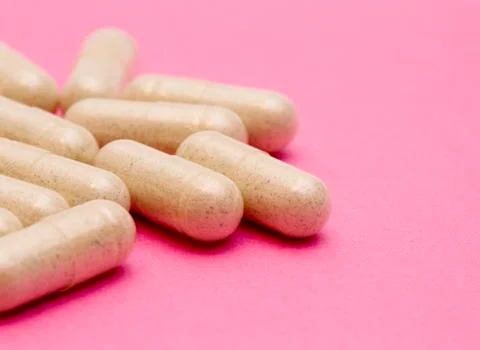 Pills on a Pink Background Stock Photos