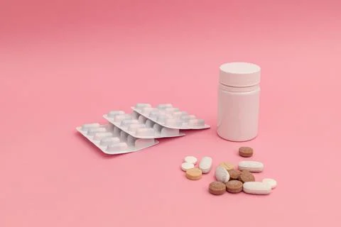 Pills on pink background Stock Photos