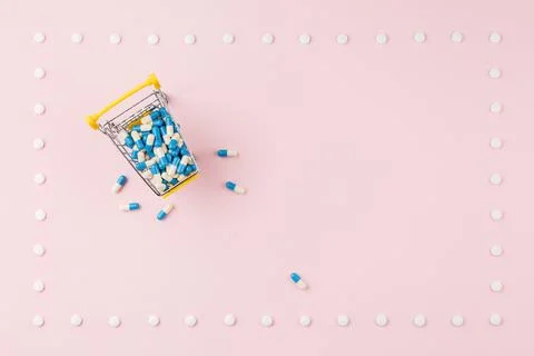 Pills on a pink table. Stock-Fotos