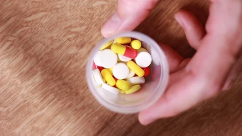 Pills in plastic can Stock Footage 93861456