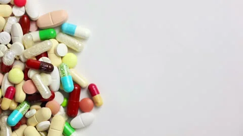 Pills pushed into video from left side Stock-Footage 23130648