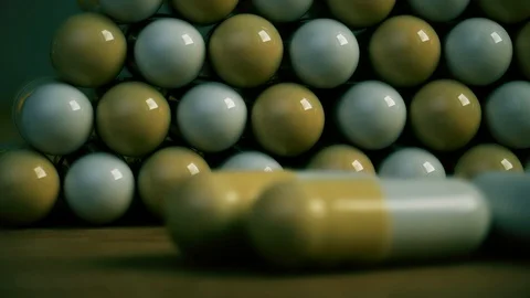 Pills in pyramid shape on dollar bill background Stock Footage 125518794