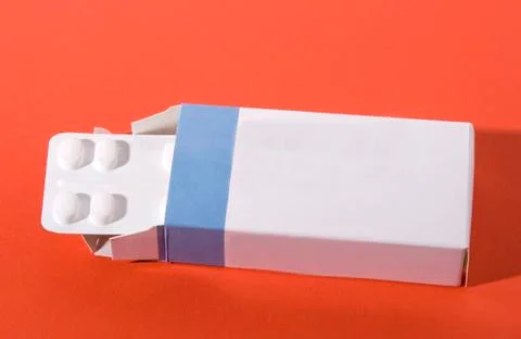 Pills on red background Stock Photos