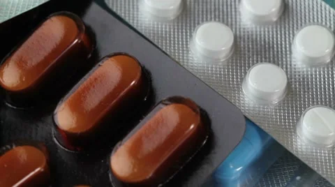 Pills rotate on white background. closeup Stock Footage 8654025