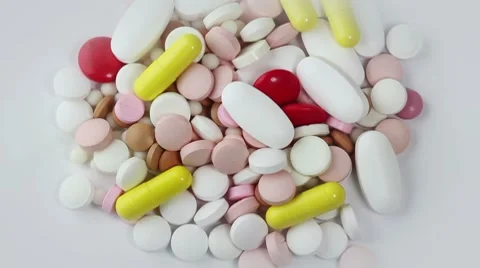 Pills rotate on white background. closeup Stock Footage 8657541