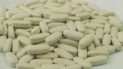 Pills rotate on white background Video stock 70949474