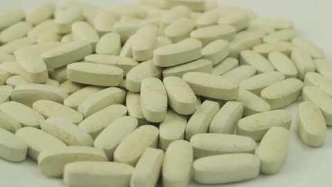 Pills rotate on white background Stock Footage 70949905