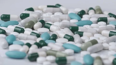 Pills rotate on a white background Stock Footage 81006603