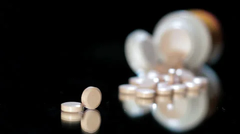 Pills rotating studio shot black Stock Footage 24820260