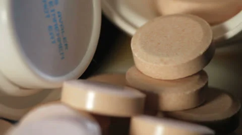 Pills rotating studio shot black Stock Footage 24820281