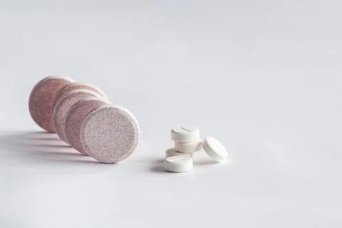 Pills in row and stack Stock Photos