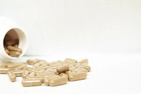 Pills scattered on the table Stock Photos
