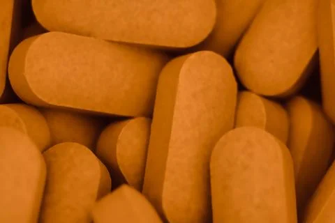 Pills scattered on the table Photos