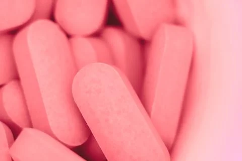 Pills scattered on the table Stock Photos