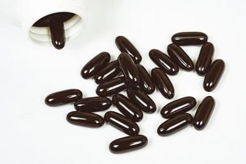 Pills scattered on the table Photos