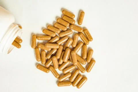 Pills scattered on the table Stock Photos