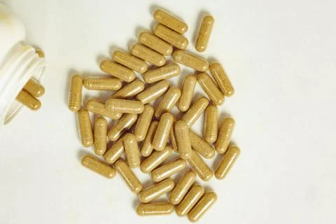 Pills scattered on the table Stock Photos
