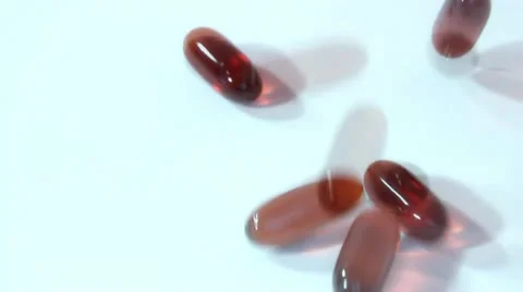 Pills scattered on a white background Stock Footage 14824994