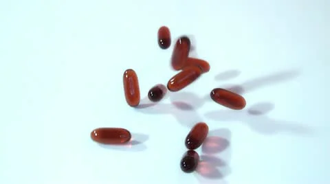 Pills scattered on a white background Stock Footage 14825569