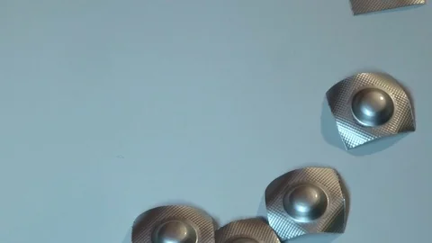Pills in shiny packing in motion Stock Footage 95077906