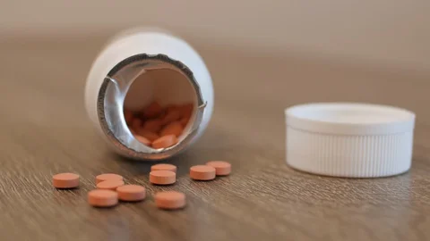 Pills sitting on a table Stock Footage 129206831