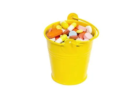 Pills in a small bucket Stock Photos