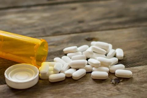 PIlls spilled on kitchen table shallow DOF-3 Stock Photos