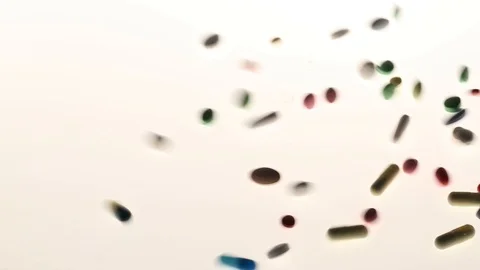 Pills spilled on white background Stock Footage 95967641