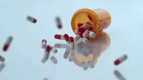 Pills spilling out of bottle in slow motion; shot on Phantom Flex 4K at 1000 fps Stock Footage 55662474