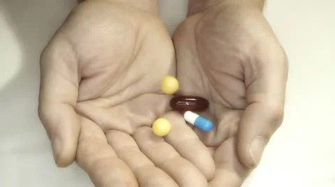 Pills spilling into the palm Stock Footage 16342378