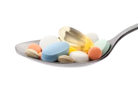 Pills on spoon with clipping path Stock Photos
