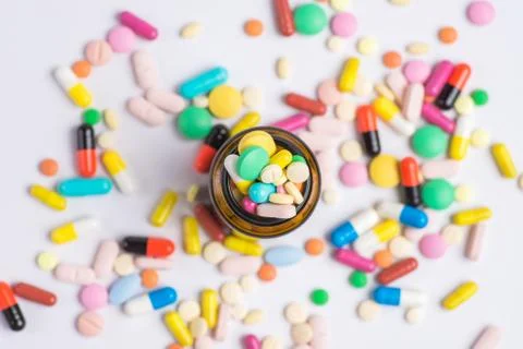 Pills, tablets in the glass bottle on a white background Stock-Fotos