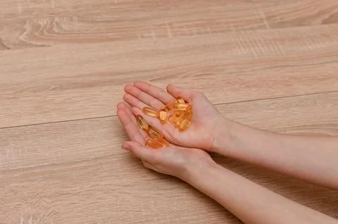 Pills tablets in the hands of a child Stock Photos