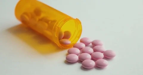 Pills turning in a seamless loop. Rotating circular drug. Pill bottle spilling Stock Footage 78533647