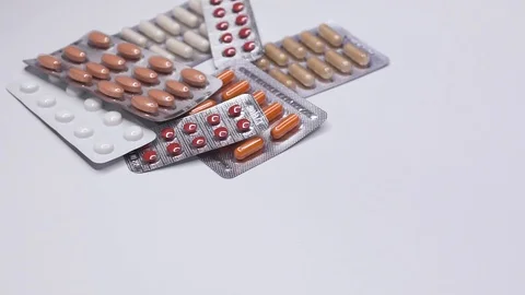  Pills on white background in slow motion Stock Footage 103466437