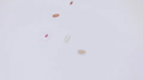  Pills on white background in slow motion Stock Footage 103466493