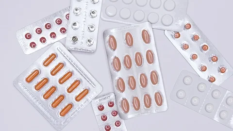  Pills on white background in slow motion Stock Footage 103466558