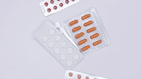  Pills on white background in slow motion Stock Footage 103466562