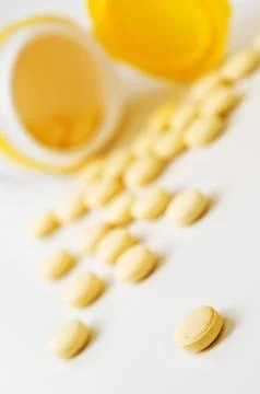 Pills on white table. Stock Photos