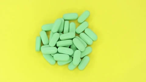 Pills on a yellow background Stock Footage 170022501
