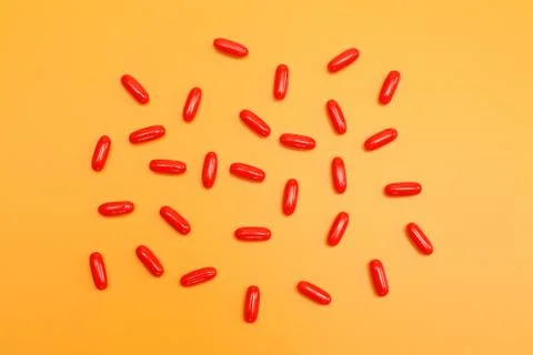 Pills on yellow background Foto stock