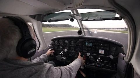 Pilot Accelerating Plane on Runway and Taking off Stock Footage 99268177