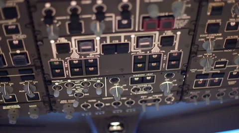 Pilot adjusting overhead controls in a 747 cockpit 4K Stock Footage 53127810