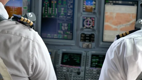 Pilot and Co-Pilot, Airplane Cockpit Interior, Cruise in Private Jet. Stock Footage 105459053