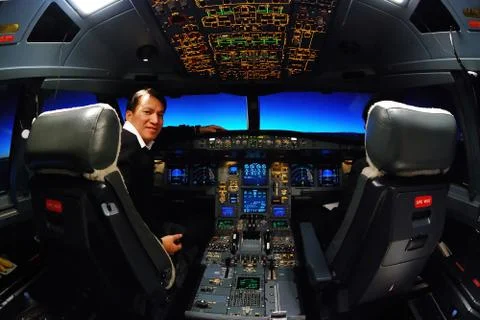 Pilot and flight deck cockpit Stock Photos