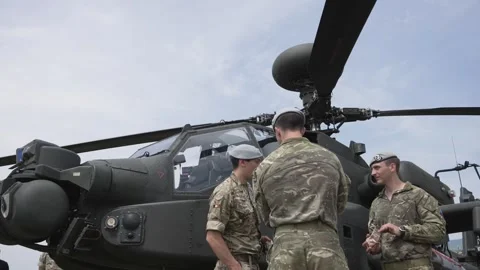 Pilot and gunner in an AH-64 Apache atta... | Stock Video | Pond5