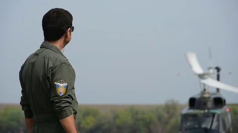 Pilot and helicopter in flight Stock Footage 85456778