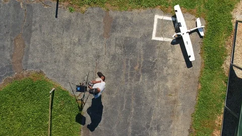Pilot and remote drone Stock Footage
