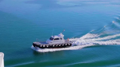 Pilot boat approaching big ferry. Blue sea, boat and wake in the sea Stock-Footage 139625338